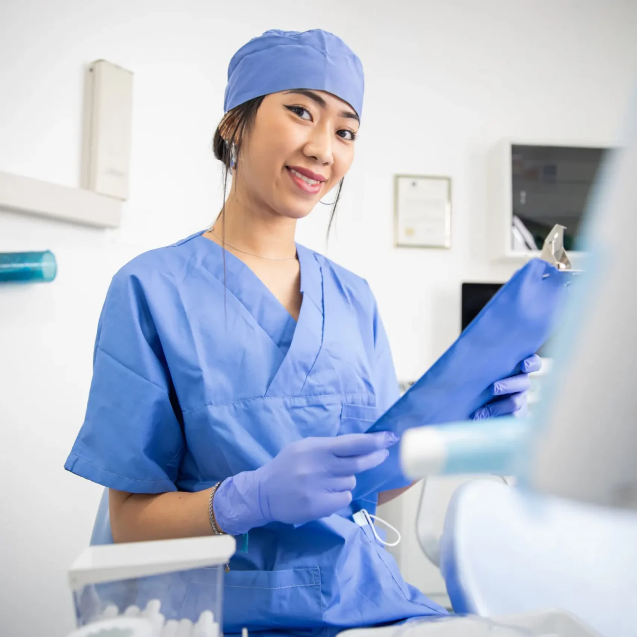 a-smiling-dentist-in-the-clinic-is-holding-medical-2023-11-27-05-25-47-utc-scaled-e1714100673582